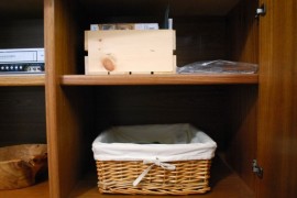 Use photo boxes to organize the media cabinet