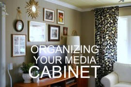 Use photo boxes to organize the media cabinet